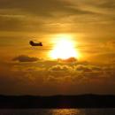 Chinook: A marine rescue Chinook helicopter silhouetted against a perfect sunset at Cape Lookout, North Carolina, USA
